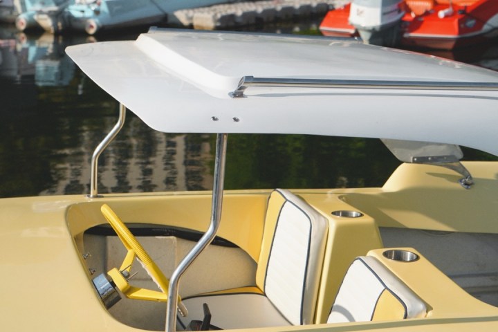 a boat sitting on top of a car