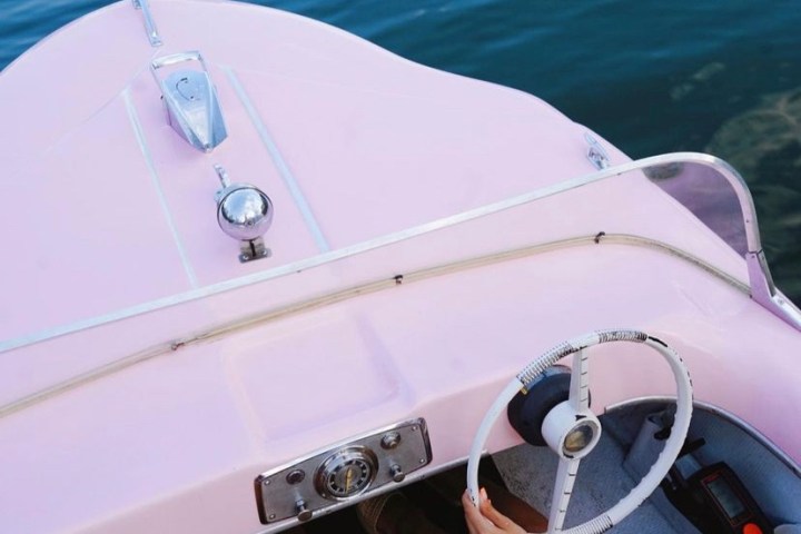 a person sitting on a boat in the water