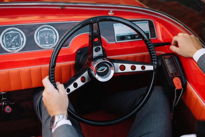 a car parked in front of a mirror posing for the camera