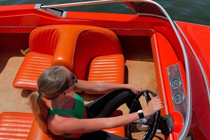 a person sitting on a boat in the water